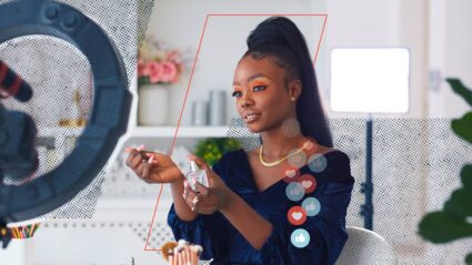 Image of a woman filming a beauty livestream
